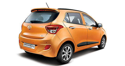 Right side rear view of orange Grandi10