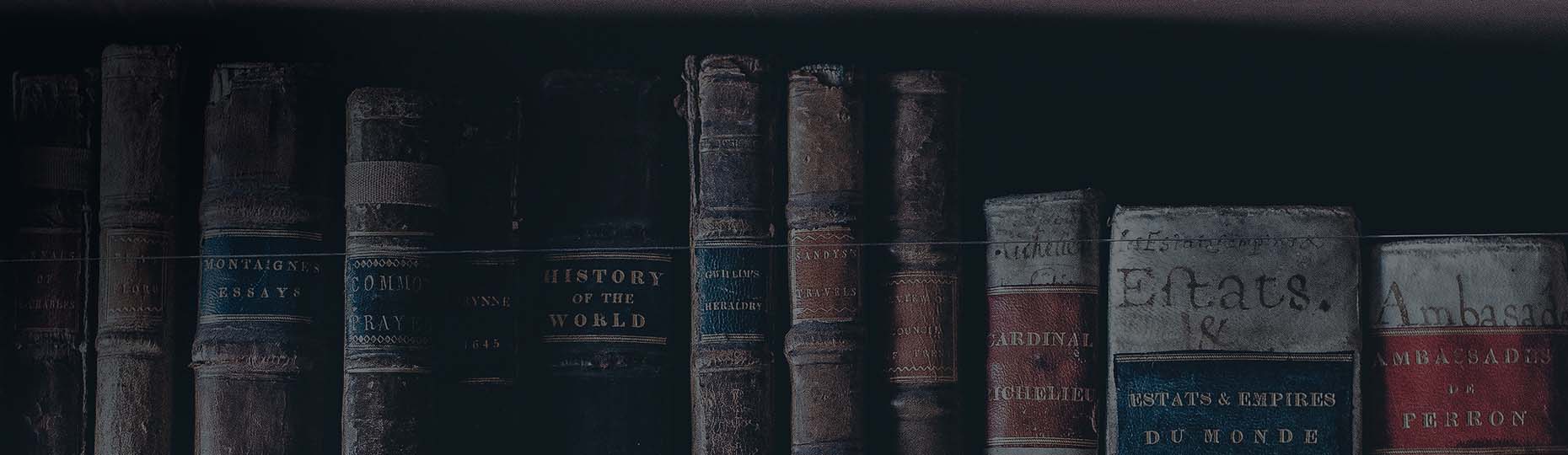 Old books are standing side by side