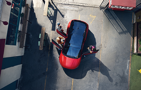 Top view of red veloster with open the door