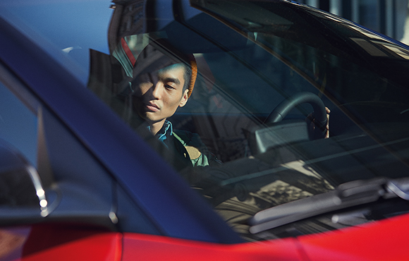A man in red veloster