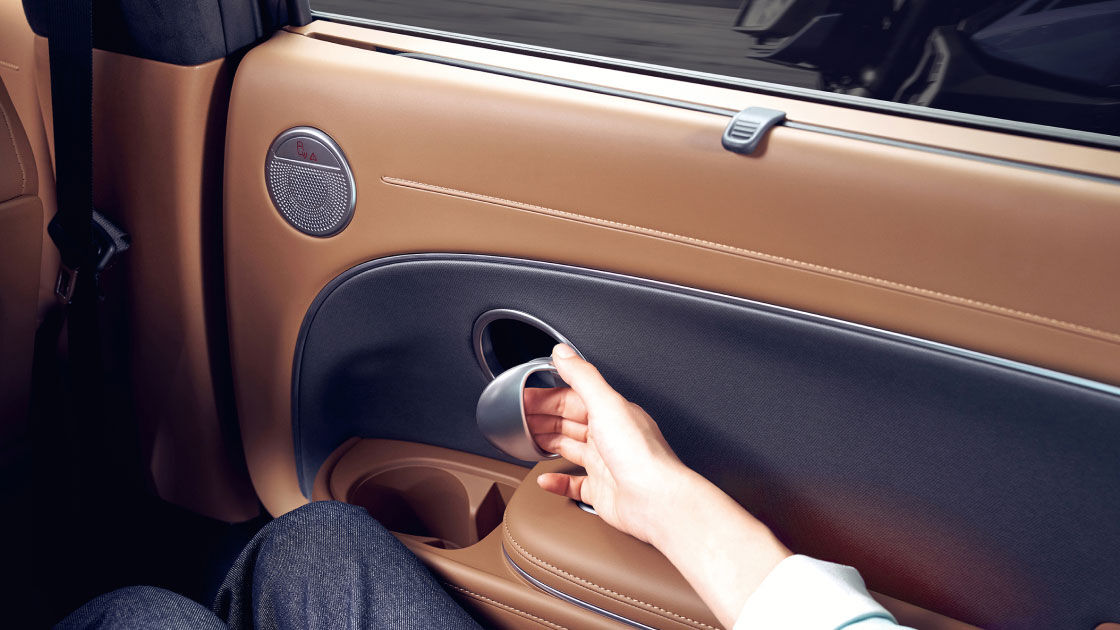 Close-up of the a person opening the door in the 2nd-row